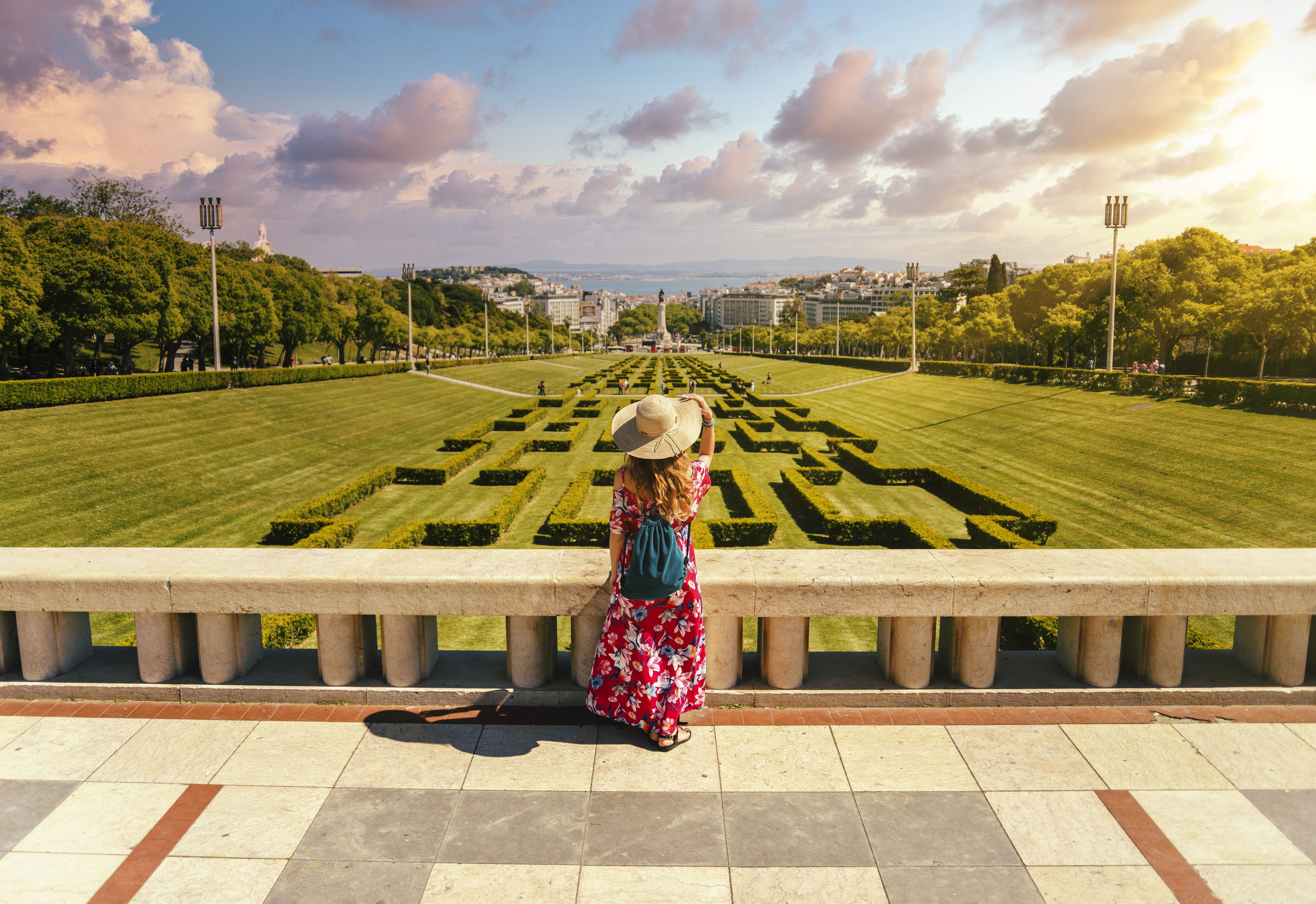 young-female-tourist-red-floral-dress-eduardo-vii-park-sunlight-portugal - Copy.jpg